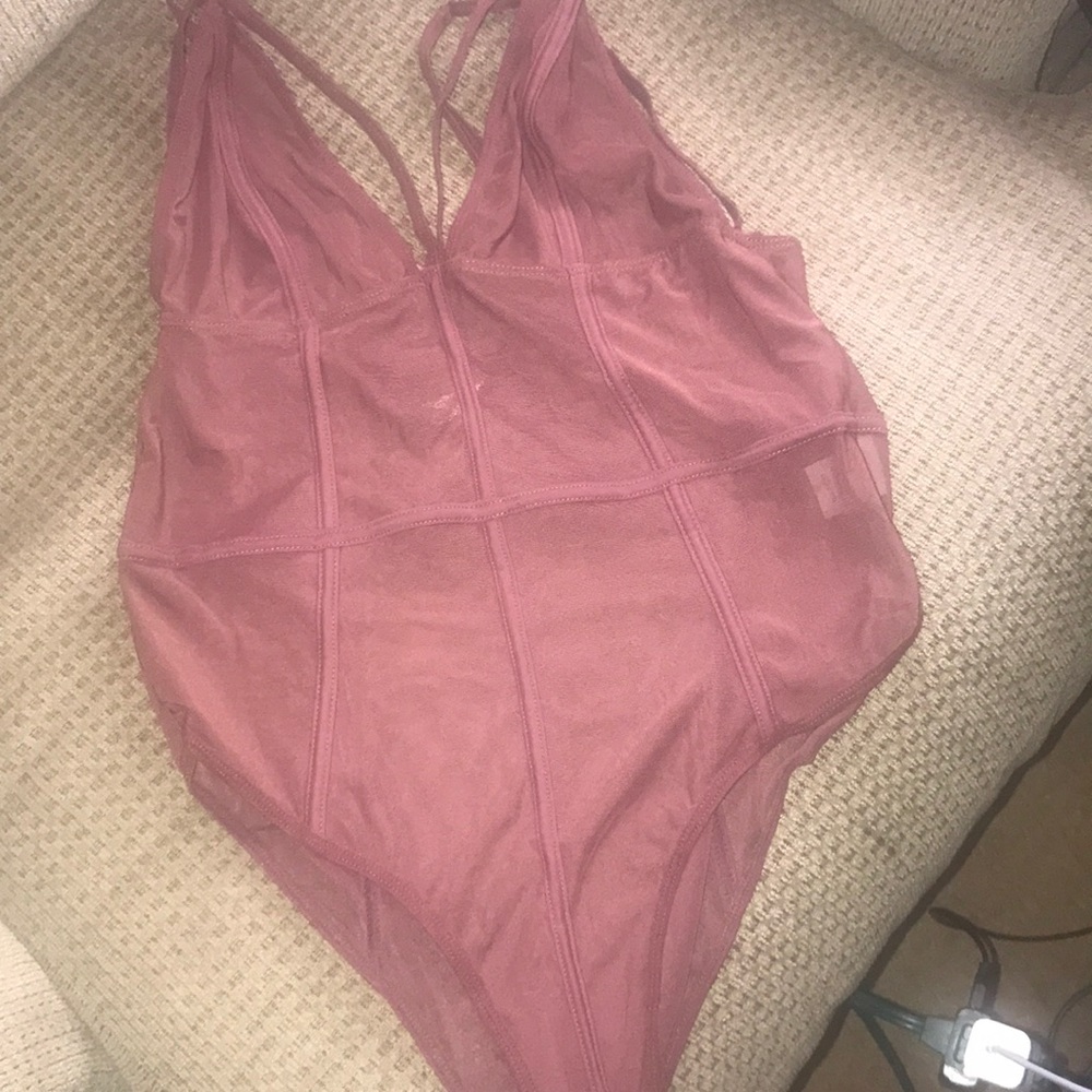 Burgundy see through body suit.